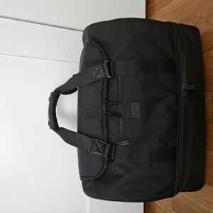 Calpak Black Travel Bag with Minimalist Design